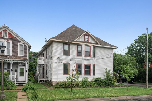 61 Delos St W, Saint Paul, MN 55107 - victorian house featuring a front yard
