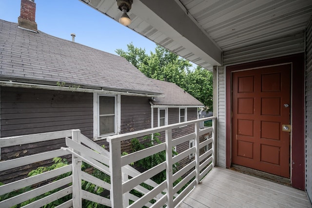 61 Delos St W, Saint Paul, MN 55107 - doorway to property featuring a shingled roof