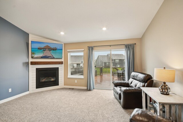 7516 Ochoa Ave NE, Otsego, MN 55330 - living area with carpet floors, a large fireplace, and recessed lighting