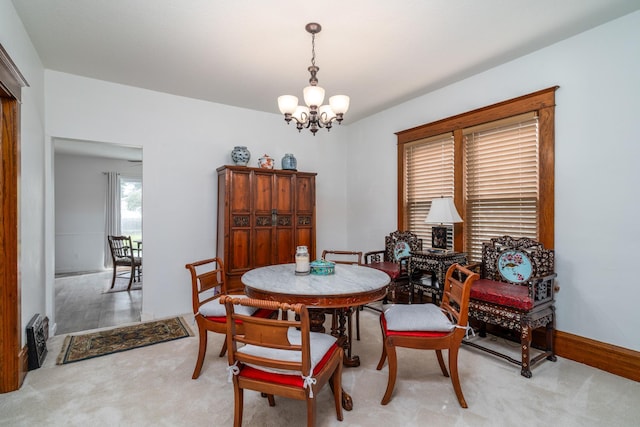 217 6th St, Crookston, MN 56716 - dining space with a chandelier and light carpet