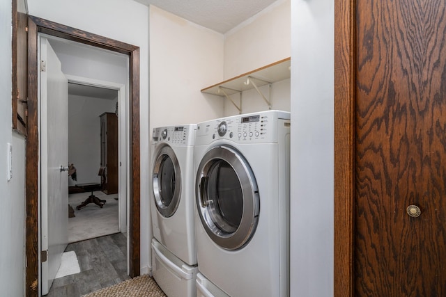 217 6th St, Crookston, MN 56716 - washroom featuring wood finished floors and washer and clothes dryer