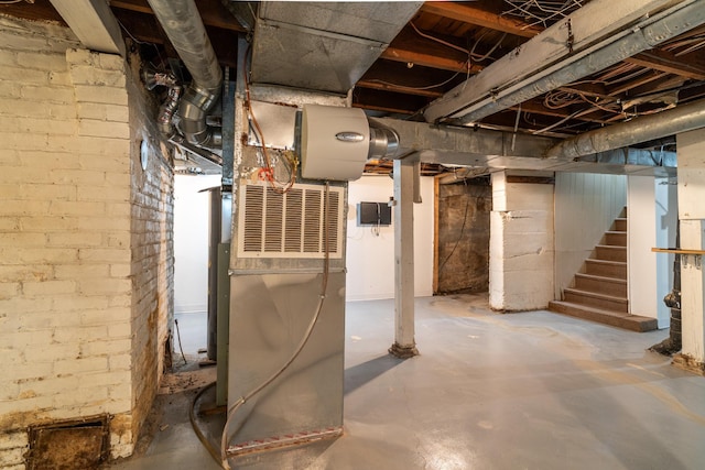 217 6th St, Crookston, MN 56716 - unfinished basement featuring stairs and heating unit