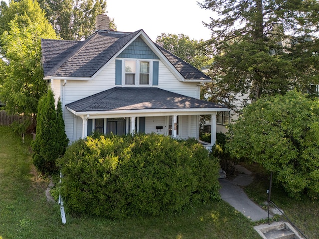 217 6th St, Crookston, MN 56716 - view of front of house featuring a chimney and a shingled roof