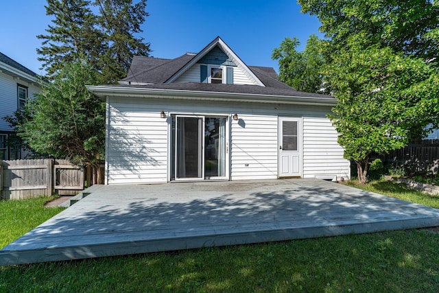 217 6th St, Crookston, MN 56716 - back of property featuring a deck and a shingled roof