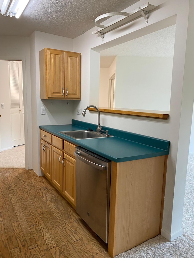 10113 34th St Unit 335, Minnetonka, MN 55305 - kitchen with stainless steel dishwasher, a textured ceiling, dark countertops, and dark wood-type flooring