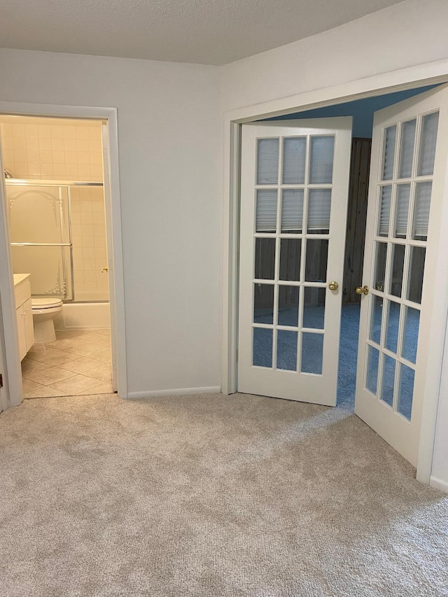 10113 34th St Unit 335, Minnetonka, MN 55305 - carpeted spare room featuring french doors