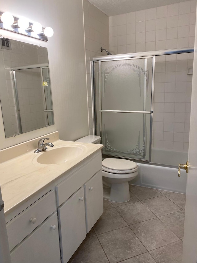 10113 34th St Unit 335, Minnetonka, MN 55305 - bathroom featuring vanity, shower / bath combination with glass door, and tile patterned flooring