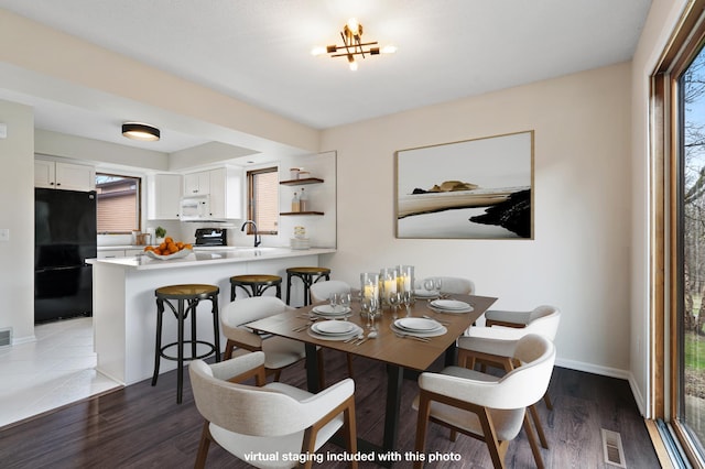 434 11th St Unit D, New Richmond, WI 54017 - dining space with baseboards and wood finished floors