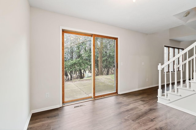 434 11th St Unit D, New Richmond, WI 54017 - empty room featuring stairway and wood finished floors