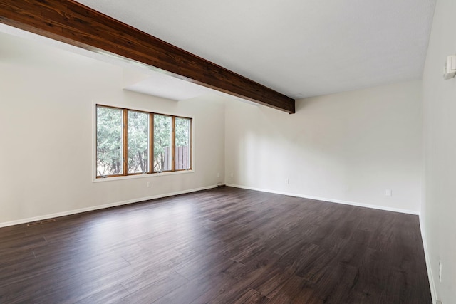 434 11th St Unit D, New Richmond, WI 54017 - unfurnished room featuring beamed ceiling and dark wood-style flooring