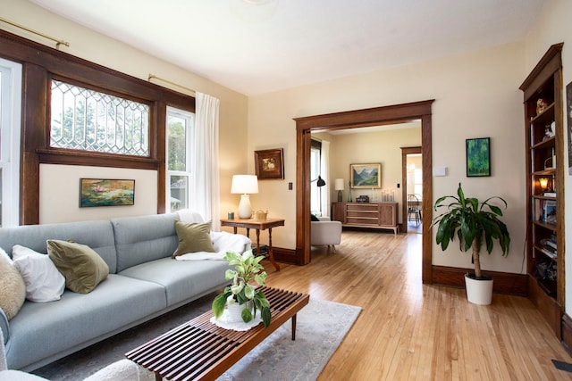 311 Fremont St, River Falls, WI 54022 - living room with baseboards and light wood-style floors