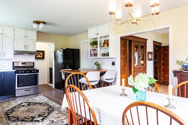 311 Fremont St, River Falls, WI 54022 - dining space featuring light wood-type flooring and a chandelier