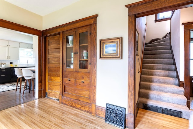 311 Fremont St, River Falls, WI 54022 - stairway with wood finished floors