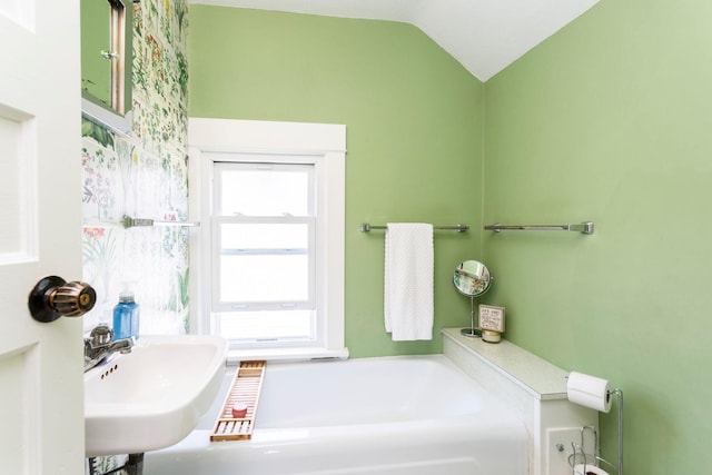 311 Fremont St, River Falls, WI 54022 - bathroom with a garden tub and vaulted ceiling