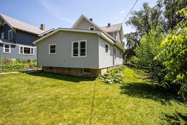311 Fremont St, River Falls, WI 54022 - view of property exterior with a lawn