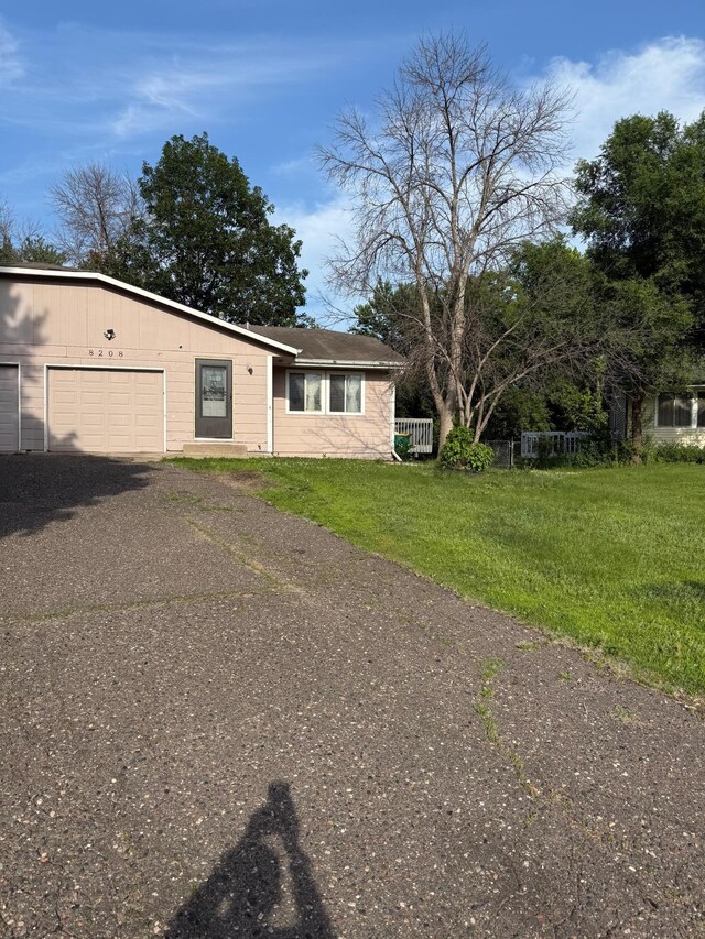 8208 Halifax Ct N, Brooklyn Park, MN 55443 - view of front of home featuring asphalt driveway and an attached garage