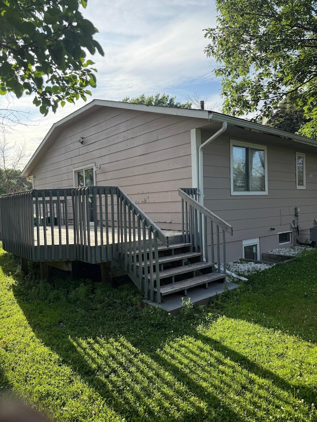 8208 Halifax Ct N, Brooklyn Park, MN 55443 - rear view of property featuring a lawn and a wooden deck