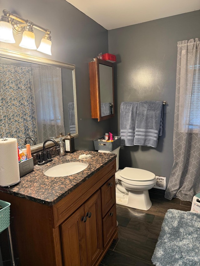 8208 Halifax Ct N, Brooklyn Park, MN 55443 - full bath featuring vanity and wood finished floors