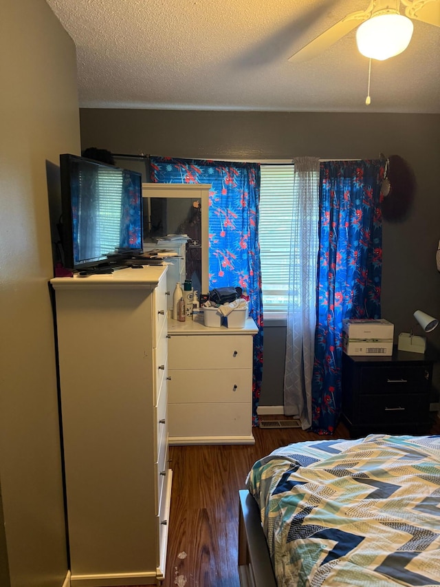 8208 Halifax Ct N, Brooklyn Park, MN 55443 - bedroom with wood finished floors, ceiling fan, and a textured ceiling