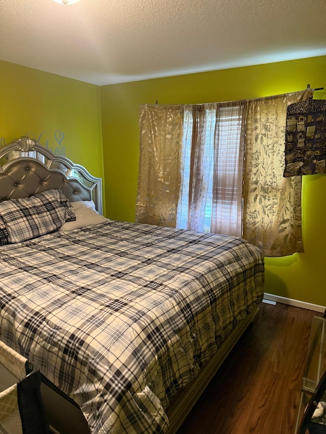 8208 Halifax Ct N, Brooklyn Park, MN 55443 - bedroom with dark wood-type flooring