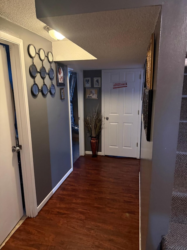 8208 Halifax Ct N, Brooklyn Park, MN 55443 - hall featuring a textured ceiling and wood finished floors