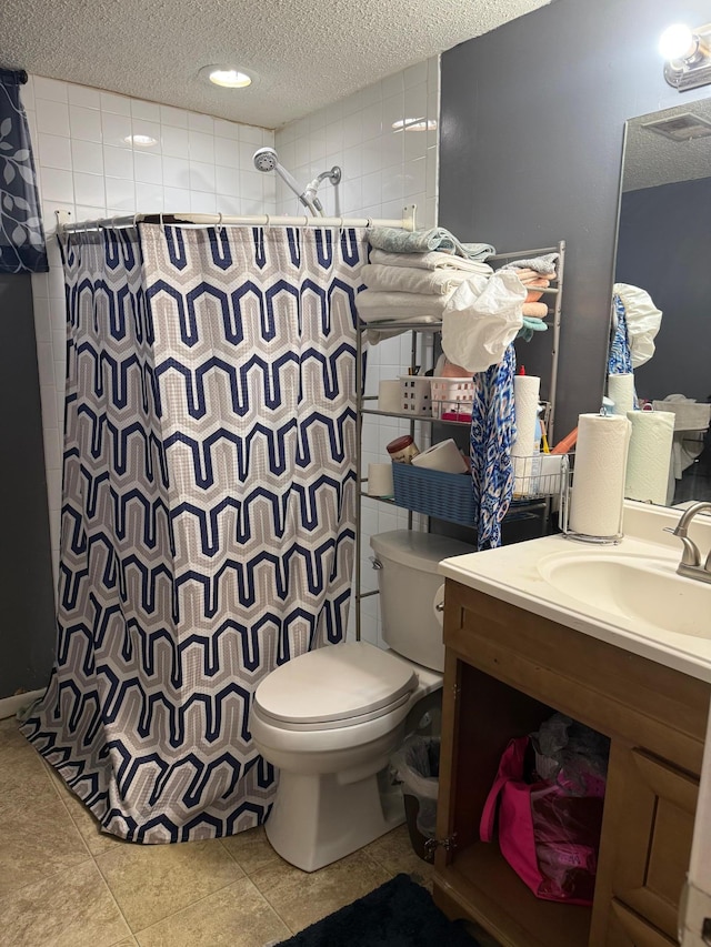 8208 Halifax Ct N, Brooklyn Park, MN 55443 - bathroom with a shower with curtain, a textured ceiling, tile patterned flooring, vanity, and tile walls