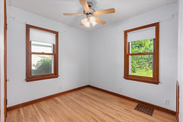3506 Boardman St, Minneapolis, MN 55417 - spare room with healthy amount of natural light, light wood finished floors, and a ceiling fan