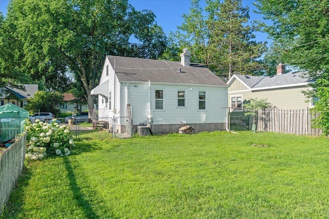 3506 Boardman St, Minneapolis, MN 55417 - back of house featuring a fenced backyard and a chimney