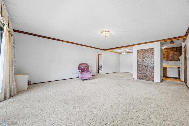 812 10th St S Unit B12, Fargo, ND 58103 - basement with ornamental molding, light colored carpet, freestanding refrigerator, and ceiling fan