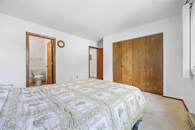 812 10th St S Unit B12, Fargo, ND 58103 - bedroom featuring a closet, carpet floors, and ensuite bath