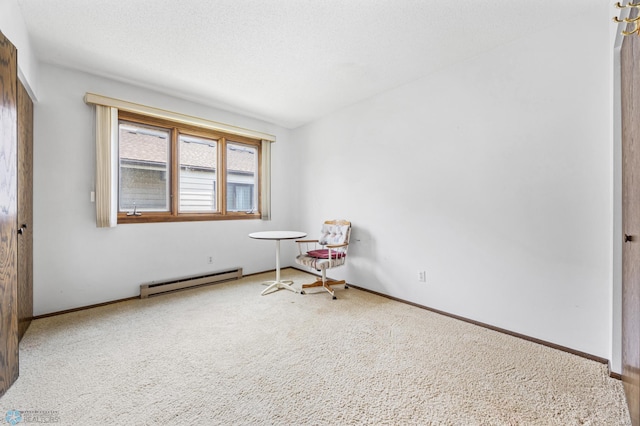 812 10th St S Unit B12, Fargo, ND 58103 - unfurnished room with a baseboard radiator and carpet