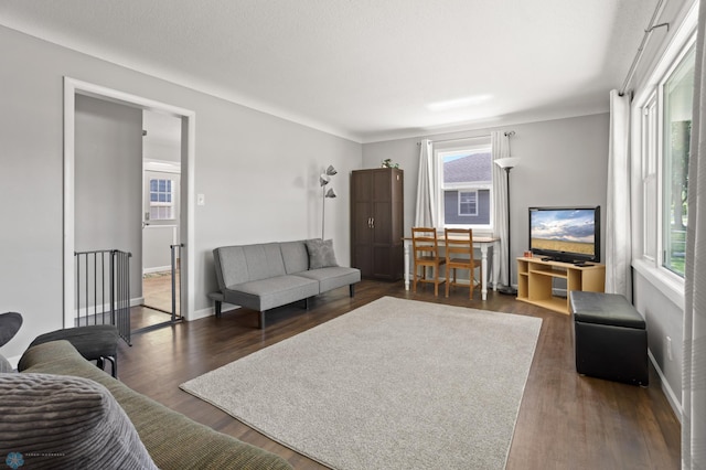 1706 14 1/2 St S, Fargo, ND 58103 - living room with dark wood-style flooring and baseboards