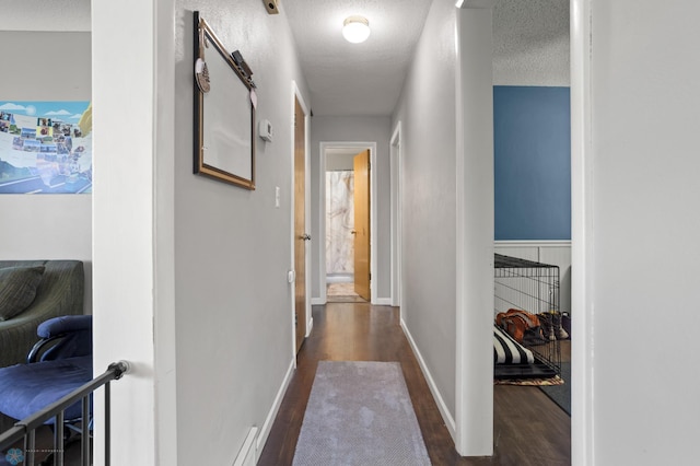1706 14 1/2 St S, Fargo, ND 58103 - hallway with wood finished floors and a textured ceiling