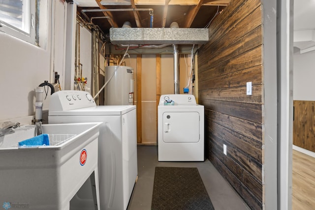1706 14 1/2 St S, Fargo, ND 58103 - washroom with electric water heater, washing machine and clothes dryer, and wooden walls