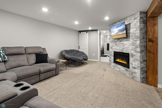 1706 14 1/2 St S, Fargo, ND 58103 - carpeted living area with a fireplace and recessed lighting