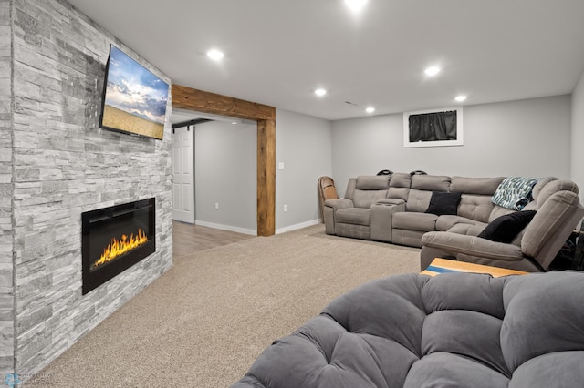1706 14 1/2 St S, Fargo, ND 58103 - living area featuring light carpet, recessed lighting, and a stone fireplace