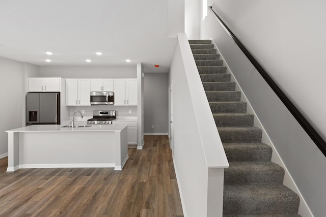 7861 Ramsey Pkwy NW, Ramsey, MN 55303 - stairs featuring recessed lighting and wood finished floors