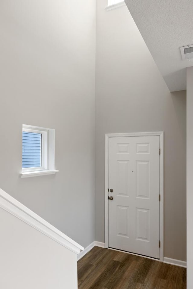 7861 Ramsey Pkwy NW, Ramsey, MN 55303 - entryway with dark wood-type flooring and baseboards