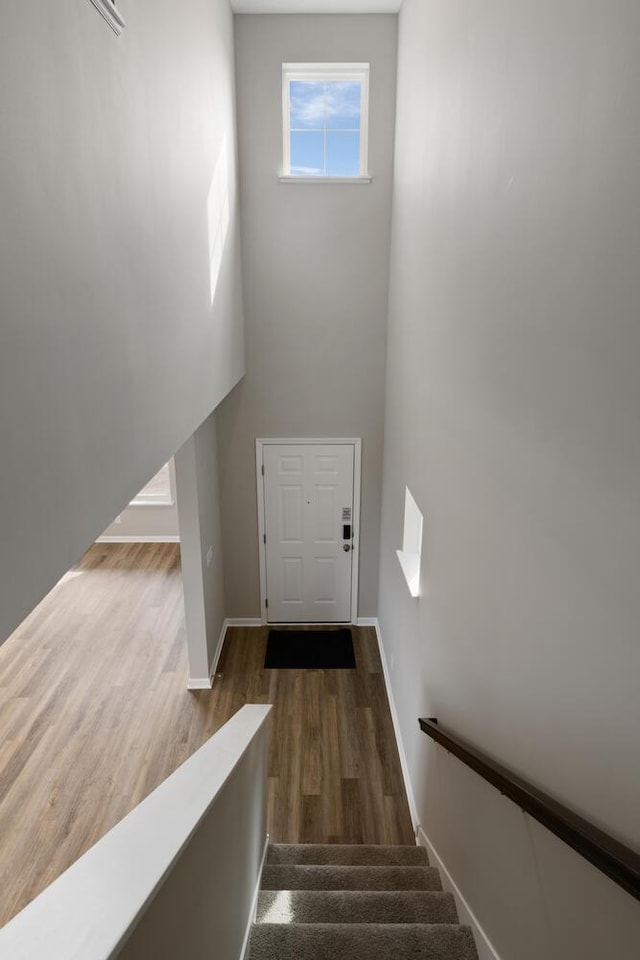 7861 Ramsey Pkwy NW, Ramsey, MN 55303 - stairs with wood finished floors and baseboards