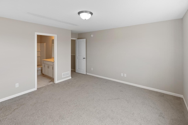7861 Ramsey Pkwy NW, Ramsey, MN 55303 - unfurnished bedroom featuring light colored carpet and ensuite bathroom