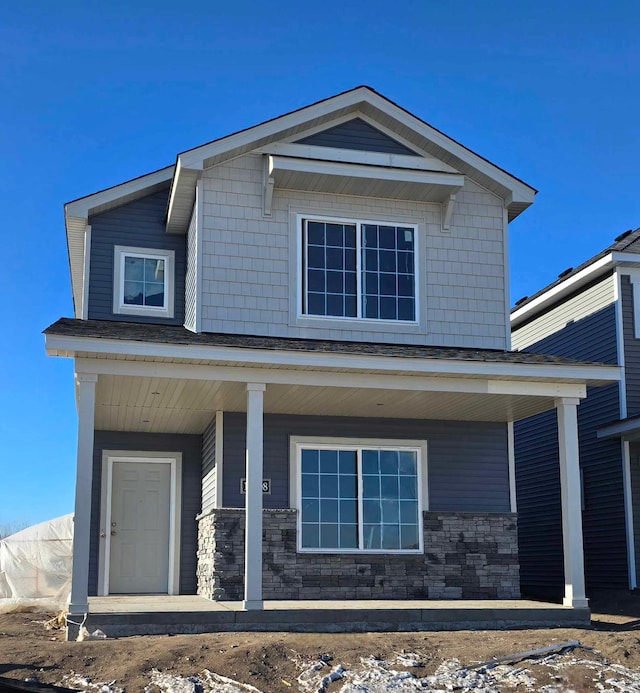 7867 Ramsey Pkwy NW, Ramsey, MN 55303 - view of front of house with a porch and stone siding