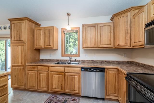 521 Spruce Ln, Crookston, MN 56716 - kitchen with stainless steel appliances, healthy amount of natural light, and dark countertops