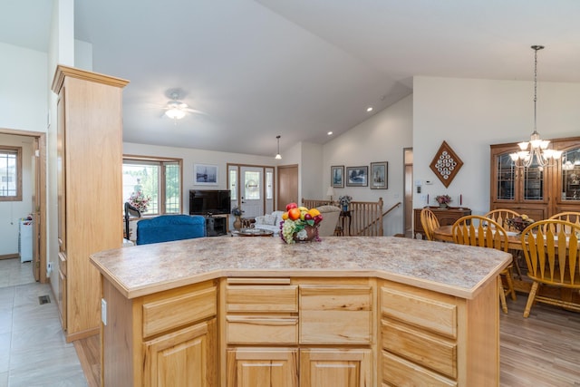 521 Spruce Ln, Crookston, MN 56716 - kitchen featuring light countertops, light brown cabinets, open floor plan, a ceiling fan, and a center island