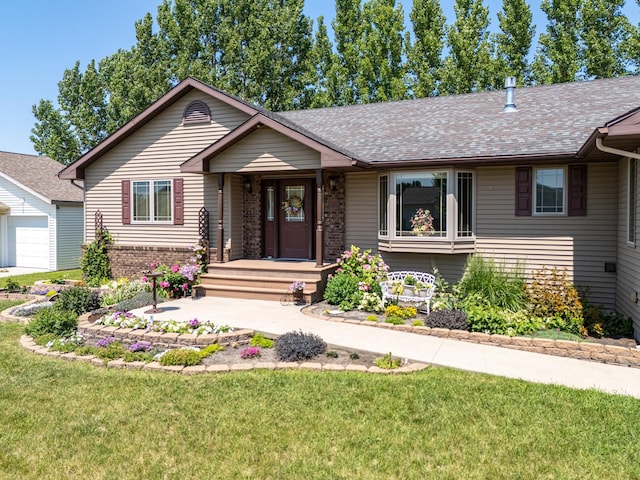 521 Spruce Ln, Crookston, MN 56716 - view of front facade with a front lawn, roof with shingles, a garage, and brick siding