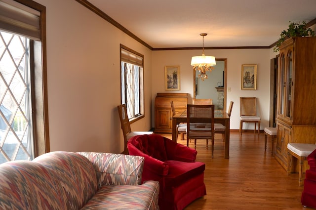 4336 Lookout Ln, Red Wing, MN 55066 - living area with wood finished floors, crown molding, and a chandelier