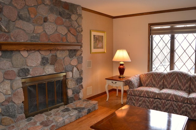 4336 Lookout Ln, Red Wing, MN 55066 - living area featuring ornamental molding, wood finished floors, and a stone fireplace