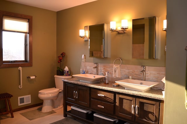 4336 Lookout Ln, Red Wing, MN 55066 - bathroom featuring double vanity and backsplash