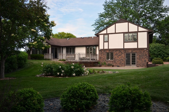 4336 Lookout Ln, Red Wing, MN 55066 - rear view of house with stucco siding, a yard, a deck, and brick siding