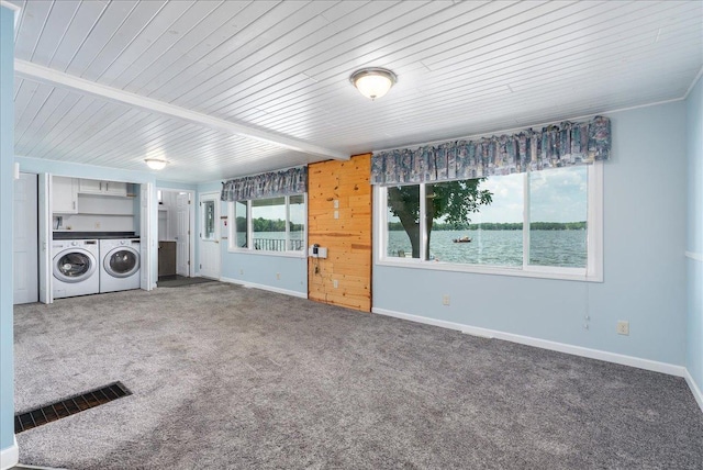773 US Highway 63, Clayton, WI 54004 - unfurnished living room with independent washer and dryer, carpet floors, wood ceiling, and a water view