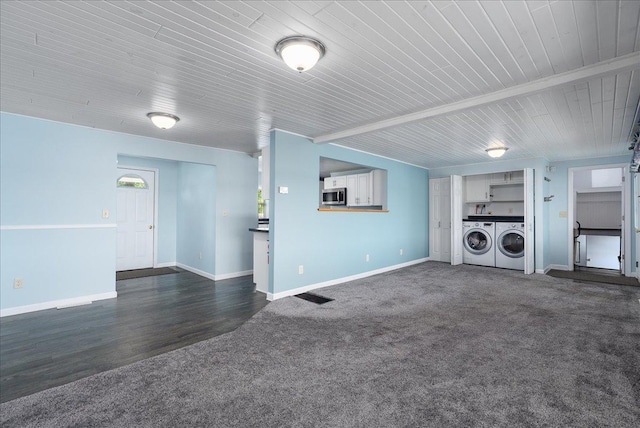 773 US Highway 63, Clayton, WI 54004 - unfurnished living room with washing machine and clothes dryer, dark colored carpet, and wooden ceiling